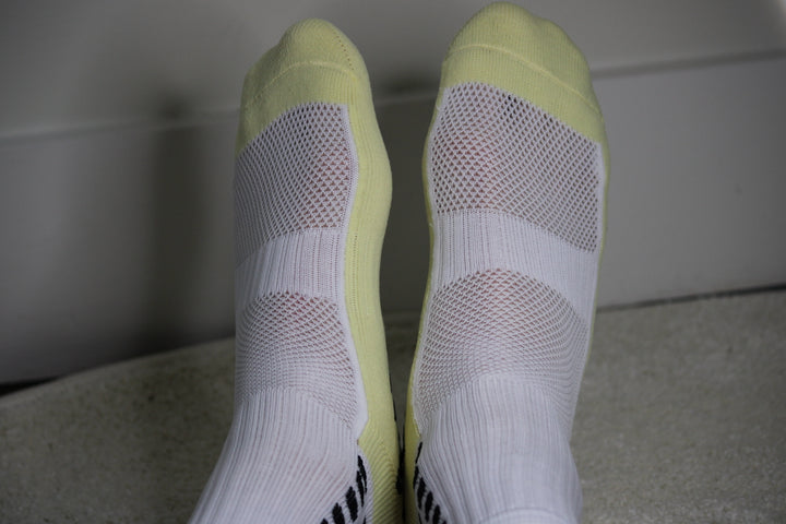 316 XI Grip Socks white and blue colorway — anti-slip rubber grip pattern on sole
