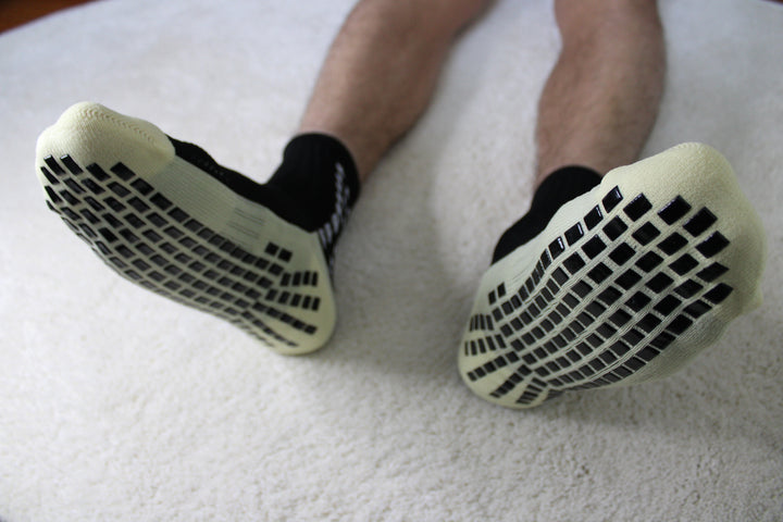 316 XI Grip Socks white colorway on pitch