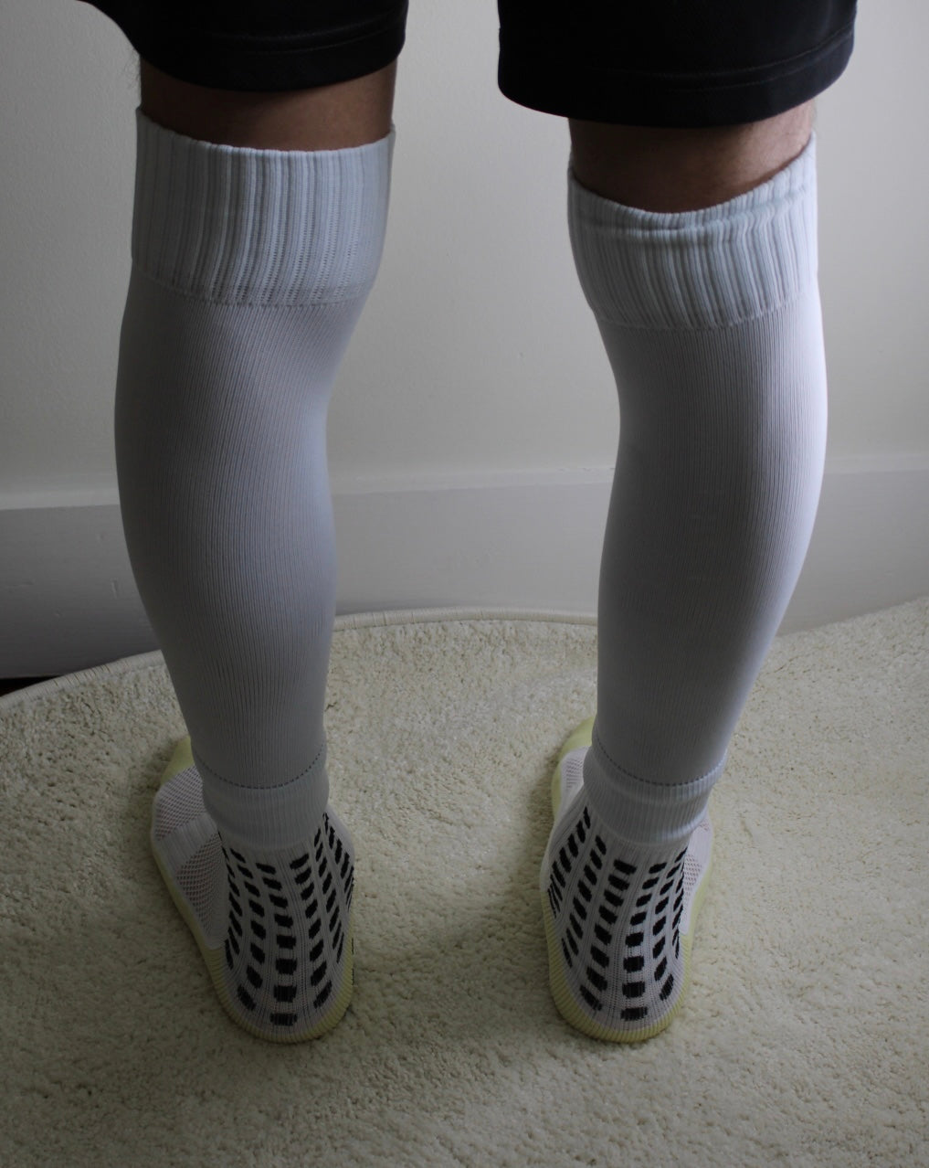 316 XI Soccer Sleeves white colorway front view showing full length compression fit