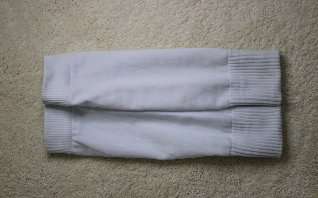316 XI Soccer Sleeves white flat lay showing ribbed compression fabric