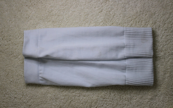 316 XI Soccer Sleeves white flat lay showing ribbed compression fabric